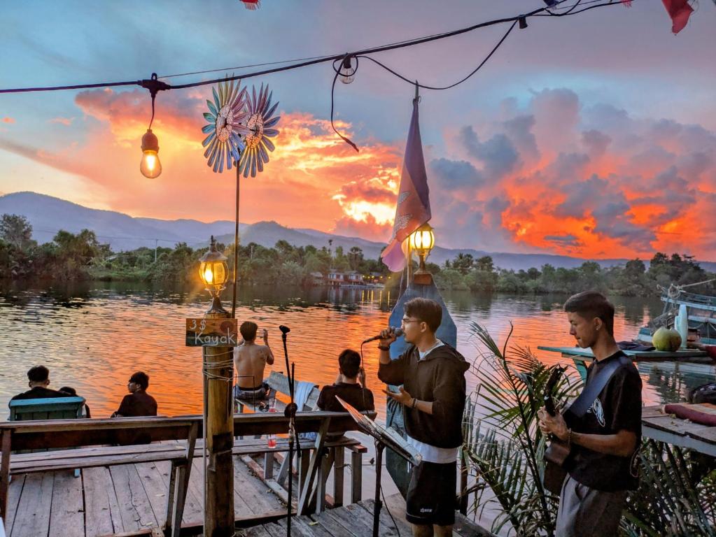 Live music at the bar as the sun sets over the river